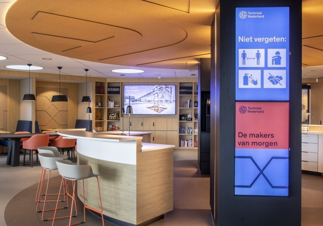 Screens Turned And Stacked For Workplace Messaging In Dutch Tech Center