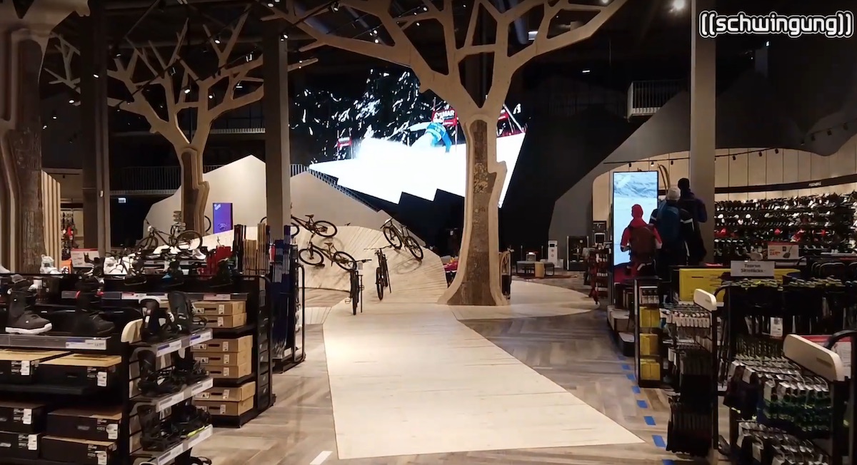 Huge Irregular-Shaped LED Wall Plays With Physical Layout Of Intersport Flagship Store