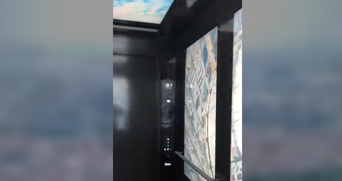 This Elevator Cab Has 10 Big Screens On The Walls And Ceiling - Screenshot