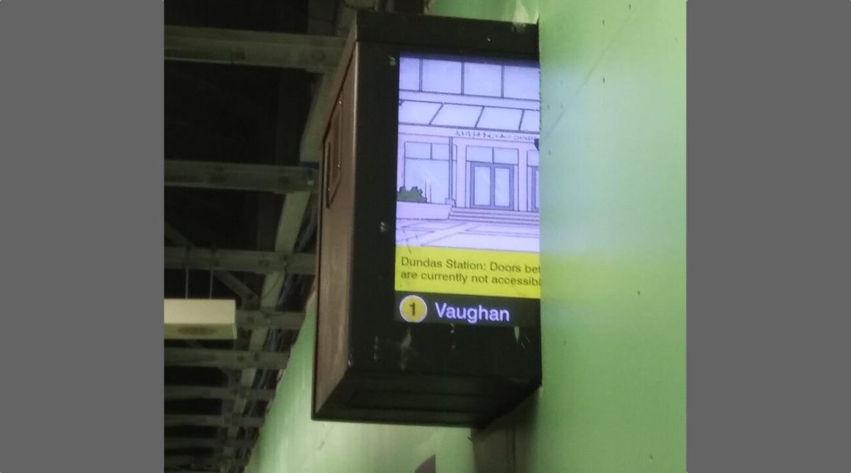Info Screen In Way Of Subway Station Renos, So Construction Crew Just Builds Around (Most Of) It