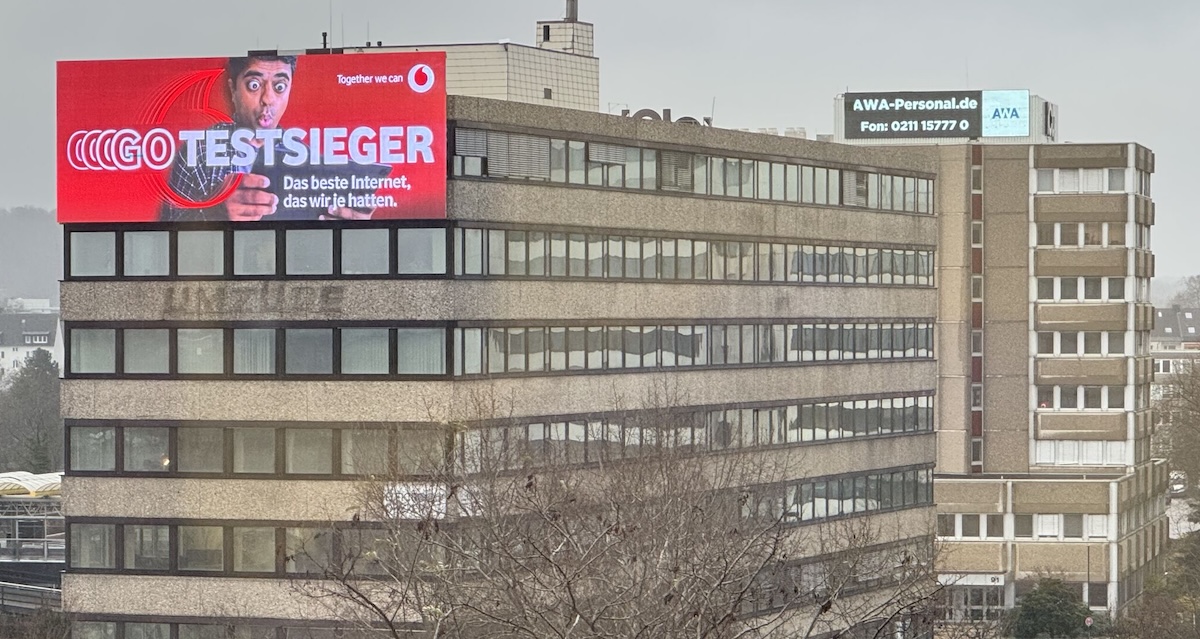 One Of The Bigger Outdoor LED Displays In Germany Just Went Up, Attached To A High Rise With Velcro