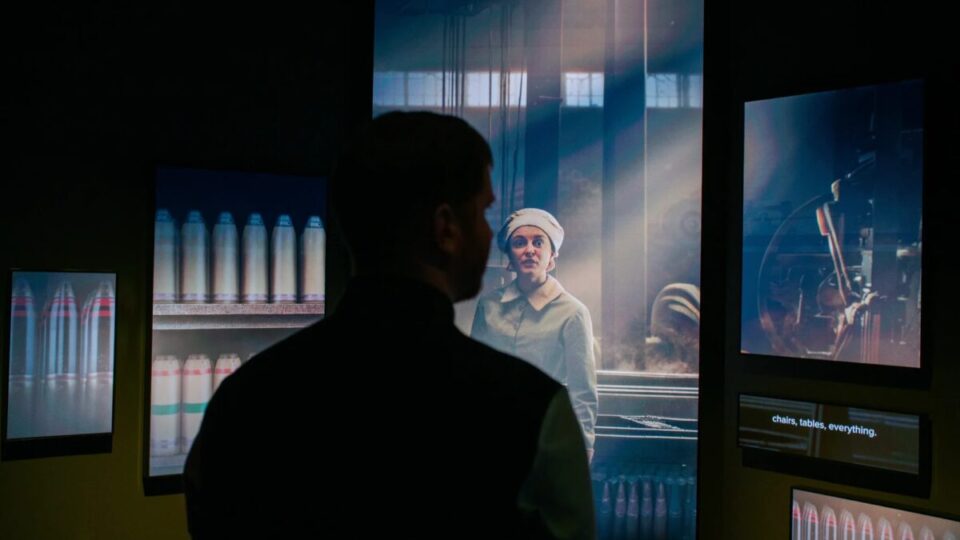 A visitor explores the newly reimagined galleries at the National WWI Museum and Memorial, where immersive displays blend history and technology