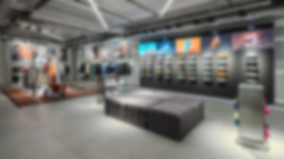 A look inside the London flagship store, with digital signage positioned above footwear displays